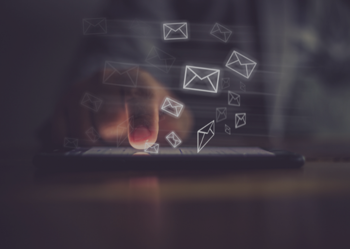 person typing on smartphone learning how to do a/b testing and sending out emails