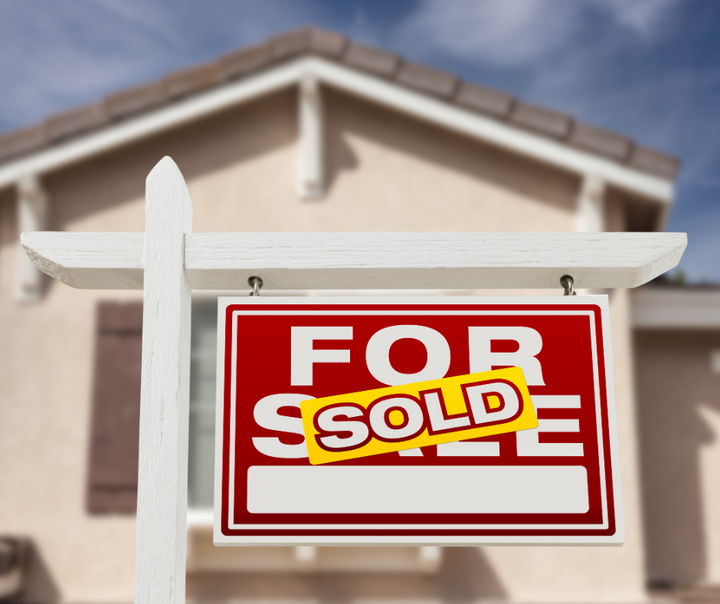 A For Sale Sold sign posted in front of a single-family home representing the federal institutional buyer ban on corporate real estate acquisitions